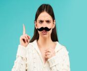 woman with fake mustache having fun funny female actress with finger up isolated blue background 265223 3244.jpg from fakes for fun actress
