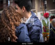 a woman with a rose flower seen embracing her partner during the sant jordi day celebration the festivity of sant jordi is celebrated in conjunction with book day and the fair of roses symbols of culture and love knight saint jordi died on april 23 303the cult of saint jordi was established in catalonia during the 8th century but it is at the end of the 19th century with the catalan renaixena that installed as the most celebrated patriotic civic and cultural day in catalonia the streets of the cities and towns of catalunya are filled with stalls with books and roses for sale tradit t5dny7.jpg from jordi romantic
