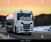 salo finland january 5 2019 white scania g500 milk truck transports valio milk along highway on a winter evening with yellow sunset sky rc679f.jpg from milk salo