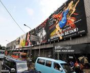 motorists pass a giant poster advertising the indonesian movie hantu puncak datang bulan or the jpgs612x612wgik20c91imshdwdfkdjvmtdnzvdvyj8w7ef2i2 ipg5ybfomq from adegan hantu puncak datang bulan
