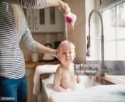 mother pours water over babies head jpgs612x612wgik20c okmznujymlno8eb8hnvjv8angkqtllbdwfdspp7dvc from bath family