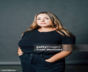 confident voluptuous woman standing with hand in pockets at studio jpgs612x612wgik20czbfgnoy9aiys6jain 8pw5heer82ai4owauu 7002iw from bbw fat gi