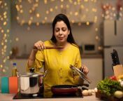 portrait of indian woman enjoying while cooking meal in the kitchen stock photo jpgs612x612w0k20cv0wdp0mhgpvziiy6zctzqblh uf8wdumfl1qn6fxj44 from xxxvldeoss ndian house wife with doctor romance xvideos