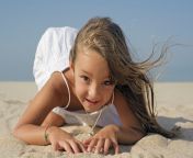 70421739 young girl playing on beach.jpg from young
