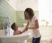 71213956 mother and son having fun at bath time together.jpg from mom and sunin bath