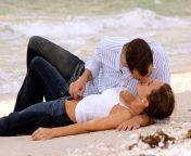 4963951 beautiful image of young couple in wet clothes laying on the beach kissing.jpg from horny beach couple kissing and fucking behin