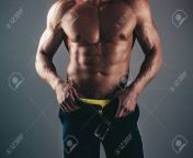 147122464 muscular with six pack abs in studio with dramatic lighting against a dark background men abs.jpg from gay sixpack