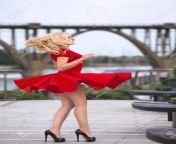 56773911 beautiful blonde woman in the red dress and high heels dancing on the wind at the summer evening.jpg from red blonde dancing