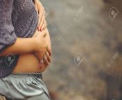 132459413 cute pregnant belly outside young pregnant woman embracing her abdomen with hands outdoor big belly.jpg from happy naked living outdoors j