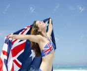 16656683 happy young woman at beach wearing australian bikini and australian flag isolated with ocean and.jpg from hot aus