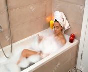 120589397 hot girl in a warm bathtub relaxing and enjoying a bath.jpg from hot in bathroom