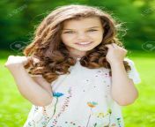 82560474 portrait of a beautiful young little girl on the background of summer park.jpg from little young