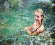 101048090 young woman tourist taking healthy bath in krabi hot springs waterfall in southern thailand tourism.jpg from www south young lady bathing video downloads