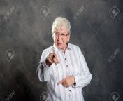 90943918 gray hairy elderly woman looking angry and pointing in to the camera.jpg from hairy old woman