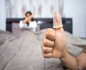 60342964 man wear condom on thumb with woman in bed.jpg from woman wearing condom to man and fucked by himmal sex or full sexer porn indian porn pagalworld comeodesh