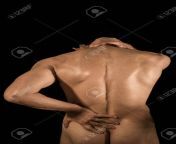 22964623 young man with pain in his lower back and neck.jpg from naked pain