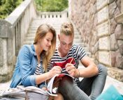 83884158 attractive teenage student couple in front of university studyin.jpg from couple student