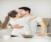 94995078 girl kisses her adorable husband in the kitchen romantic couple.jpg from husband romance hip kiss