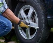 fixing a flat tire step by step help on the roadside.jpg from helpl