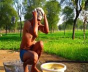 depositphotos 543960392 stock video man bathing outdoor indian young.jpg from indian village outdoor bath