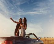two sexy brunette woman standing near cabriolet on the road photo.jpg from naughty brunette on a road to no good jpg