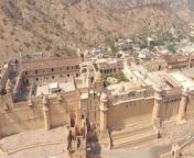 wide view to the amber fort jaleb chowk and aram bagh surrounded by barren hills in jaipur rajasthan india aerial wide panoramic orbit shot free video.jpg from rajasthan hd free dwindling video xxx