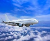 plane in the sky passenger commercial plane flying above the clouds concept of fast travel vacation and business photo.jpg from flight jpg
