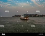 ship heading towards river island at dusk image is taken at peacock island guwahati assam india it is showing the serene beauty of nature at dusk 2cdhn04.jpg from assam beauty showing