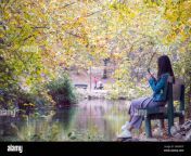 cute solo lonely girl woman women relaxing unwinding while seated at natural park surrounded by vegetation in fall or autumn in murcia spain 20 2a4w9yp.jpg from solo cute