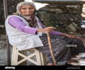 a sad looking elderly lady with piercing green eyes living a semi nomadic lifestyle in a village in turkey 2a8hej8.jpg from vilage lady pising