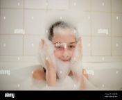 young girl inside the bath a little girl bathes in a bathtub with foam a girl of 9 years old takes a bath purity concept 2ab87eb.jpg from ♥breastfeeding ♥ ✔after he takes a bath