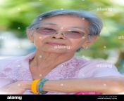 head shot closeup front face of a beautiful woman healthy senior asian people dress in thai style clothes portrait old lady relaxing outdoors in the 2c35b4f.jpg from thai ol