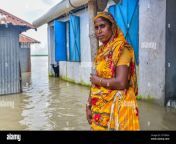 bogura bangladesh 16th july 2020 a woman poses in front of her flooded houseat least 15 million people have been affected with homes and roads in villages flooded flood forecasting and warning centre ffwc officials have reported the flood situation in 15 northern and central districts has been due to the rise in water levels of the main rivers including the brahmaputra jamuna padma teesta and dharla credit sopa images limitedalamy live news 2c7nxkh.jpg from www news bd vilage nnx sex video com