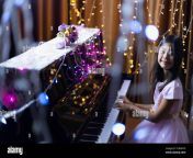 a cute asian schoolgirl is playing the piano in a room decorated with flashing lights 2c8hnyd.jpg from young asians playing flashing and masturbating on camera