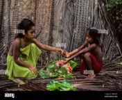 micronesia caroline isls pulap island native girls making flower leis 2b0k9dk.jpg from ls island