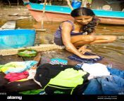 girl washing clothes in river lago do coridiqui community negro river novo airo amazonas brazil 2b1rr0w.jpg from deshi wet