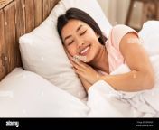 chinese girl sleeping well in cozy bed in bedroom indoor 2bn563p.jpg from sleeping chinese
