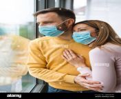 couple home isolation auto quarantine wearing face mask protective for spreading of disease virus 2bm0eme.jpg from wear mask quarantine