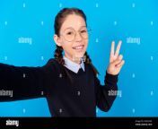 photo of cute happy nice schoolgirl good mood make selfie show v sign isolated on blue color background 2gd2cw5.jpg from scholl gril selfi shows