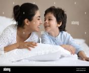 young happy indian mother playing with small son on bed 2gwc1p9.jpg from indian mom and small son sex vid