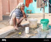 rajasthan india 07 02 2018 an old woman in a village in the rajasthan is enjoying to refresh herself on a hot day 2em3r1t.jpg from indian village old lady sexy