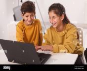 cute little arab boy and his teen sister laughing working on online project on a computer together 2dnma4f.jpg from arab his sister