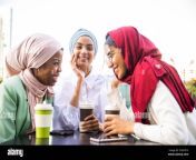 multiethnic group of muslim girls wearing casual clothes and traditional hijab bonding and having fun outdoors 3 arabic young girls 2g87g1x.jpg from 2 haijabi having some fun each other