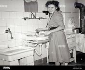 housewife in the kitchen infront of a washbasin europe germany hamburg additional rights clearance info not available 2g9nkkt.jpg from vintage german housewife