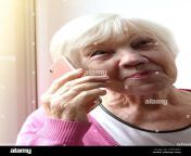 portrait of a senior woman holding a smartphone in her hand 85 year old grandmother chatting on the phone 2f4n48h.jpg from 85 granny women