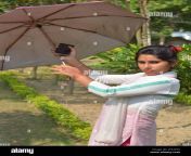 indian bengali teenage girl cotton white wearing salwar kameez and dhupatta opening an umbrella selective focusing 2f34y93.jpg from indian desi bangali cute salwar and saree call loving sex romance with her lovehelugu hot sex girlsoads