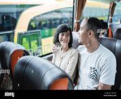 a man and woman chatting and laughing while sitting on the bus 2f94723.jpg from bf bus