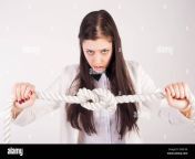 portrait of pretty student or businesswoman thinking that solve a problem to untie knot at white background 2kfe1x6.jpg from female knotting