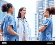 young caucasian doctor in a lab coat standing outside and talking to mixed race nurses in scrubs diverse group of healthcare professionals african american medical nurses in uniform with a physician 2pr7k9d.jpg from doctar nurse amrican