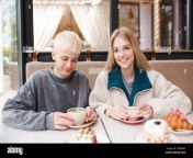 happy teenage couple girl and boy 17 18 year old having fun eating desserts in cafe together first date teenagerhood 2r8er6k.jpg from first date with 18 old cutie on the river bank ended with blowjob and cum in mouth